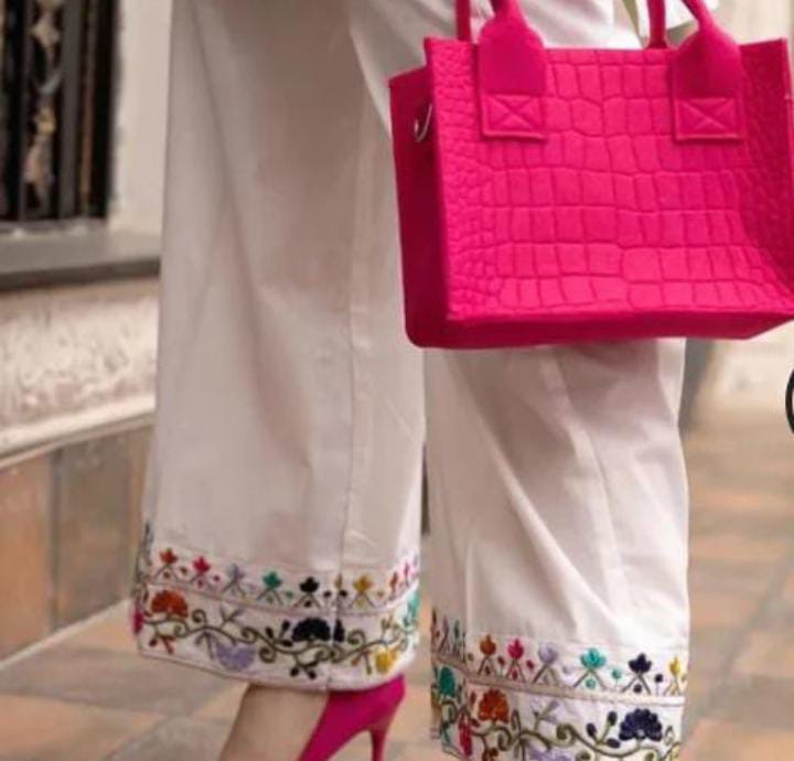Elegant woman's 2pc suit shirt and trousers.