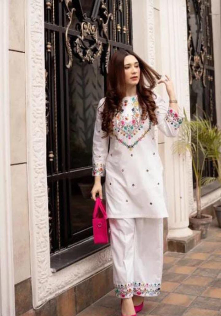 Elegant woman's 2pc suit shirt and trousers.